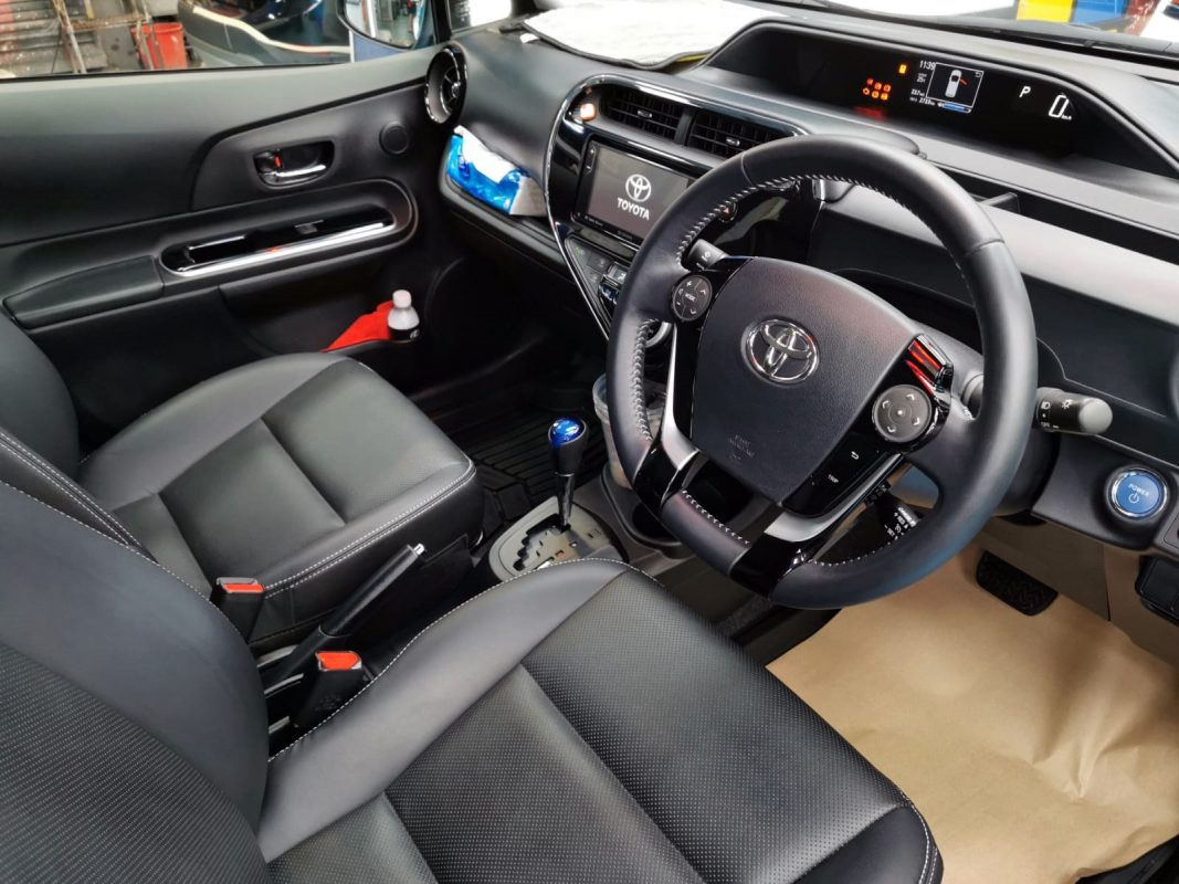 The Toyota Prius parked in the workshop, freshly coated.