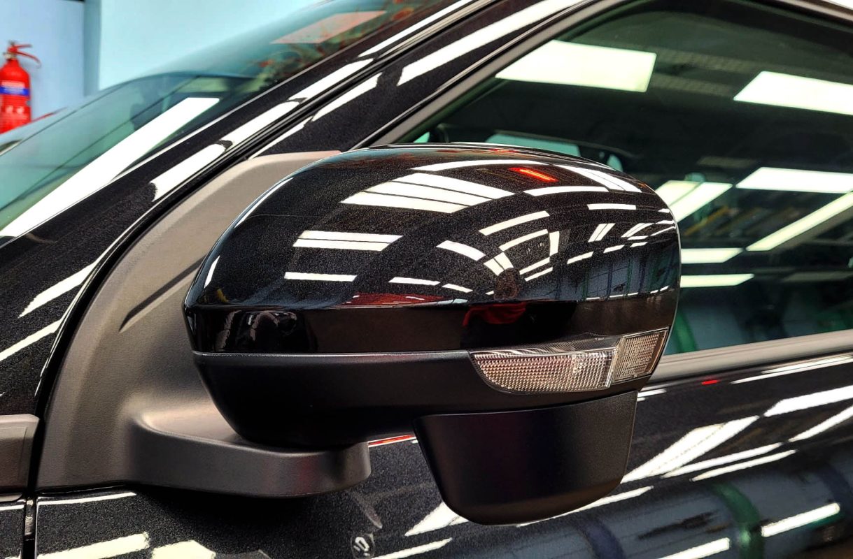 Rear quarter of the Raize, glossy and protected.