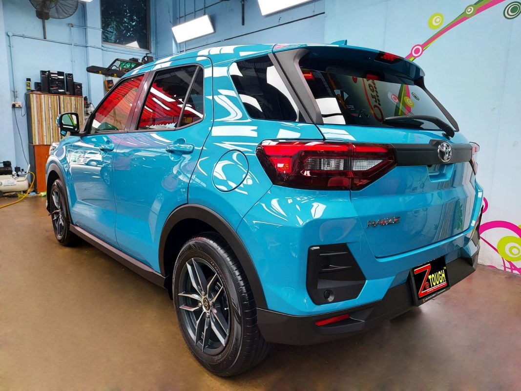 Rear quarter of the Toyota Raize, glossy and protected.
