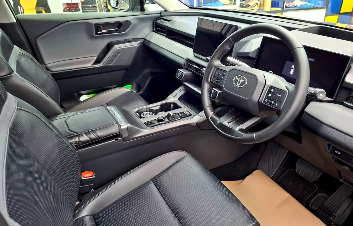 Cleaned RAV4 cabin with leather seats, steering wheel and dashboard screens.