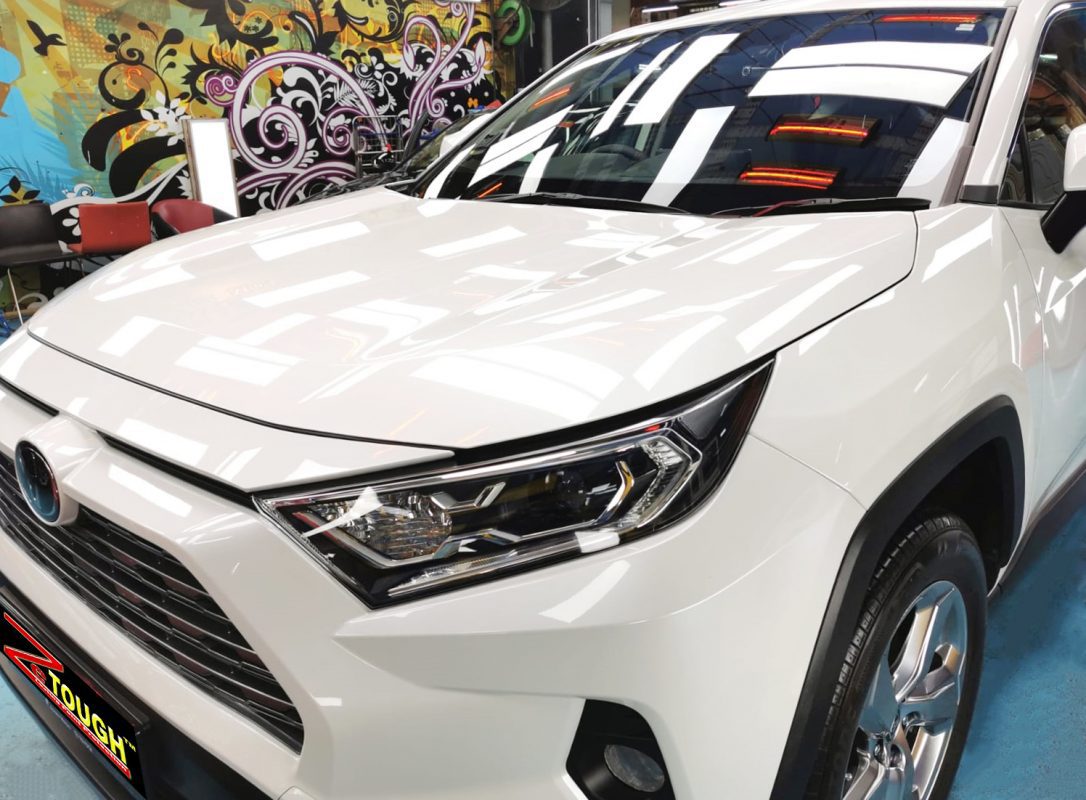 The Toyota RAV4 from a side angle after the ceramic coating.