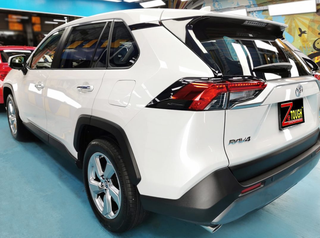 Rear quarter of the RAV4, glossy and protected.