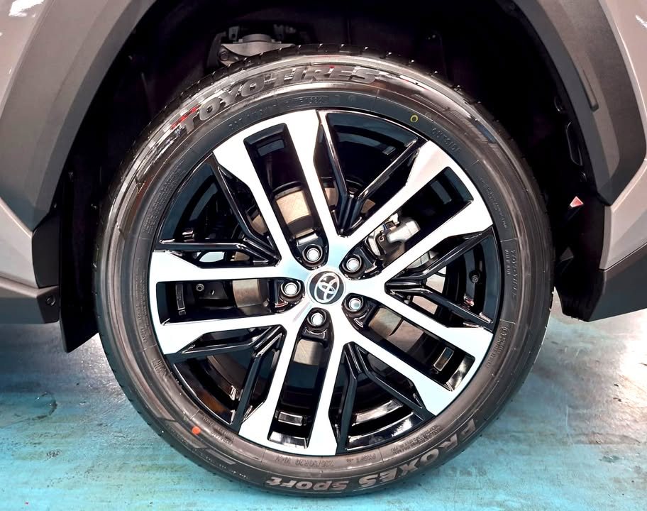 Black and silver alloy wheel on the RAV4 after cleaning.