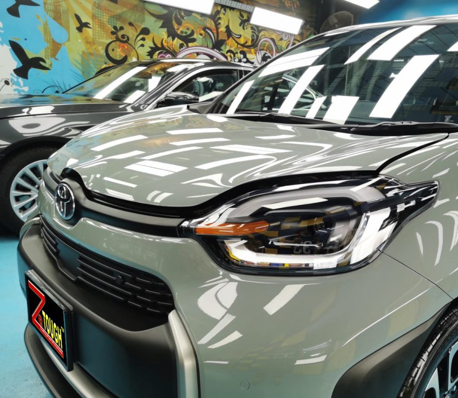 The Toyota Sienta from a side angle after the ceramic coating.