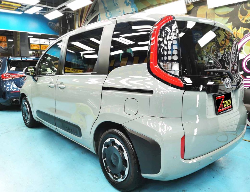 Rear quarter of the Toyota Sienta Hybrid, glossy and protected.