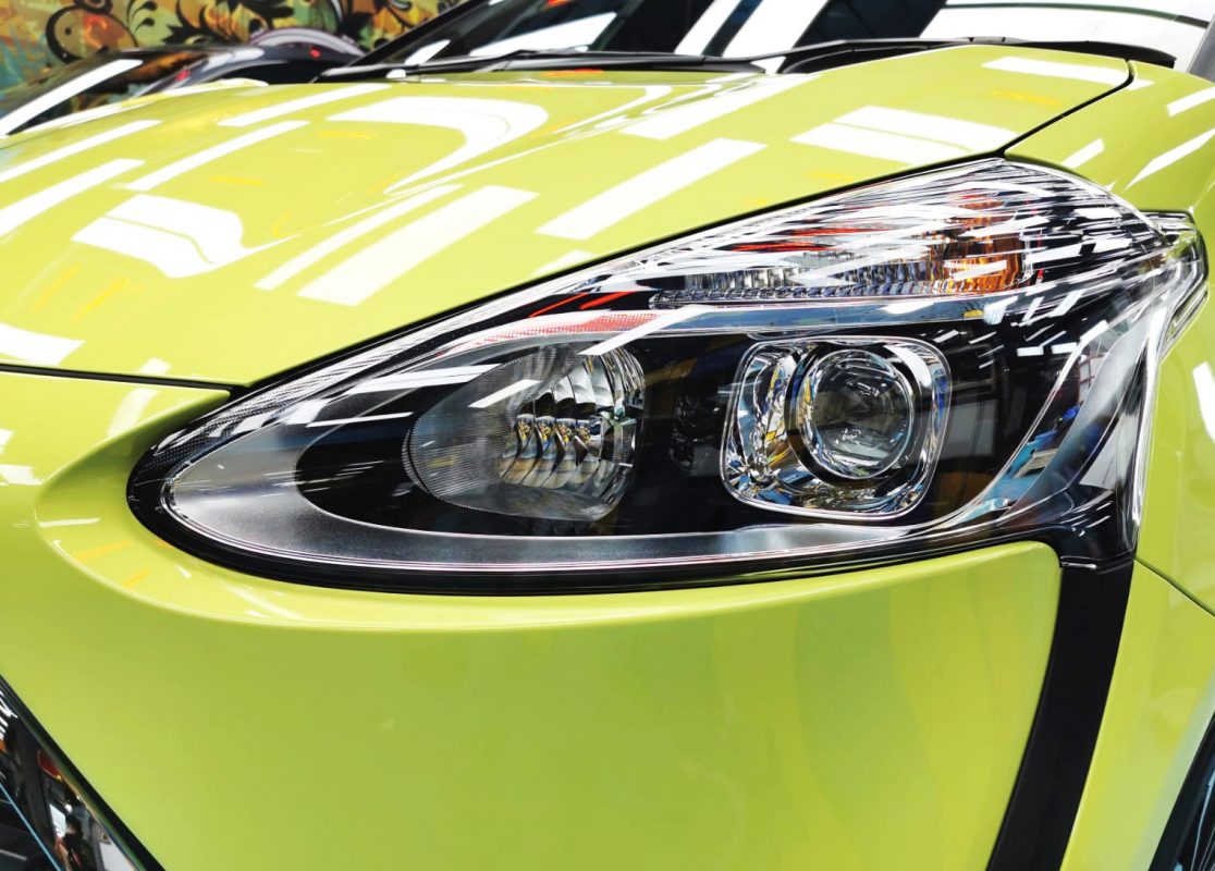 The Sienta's coated paintwork showing clean reflections.