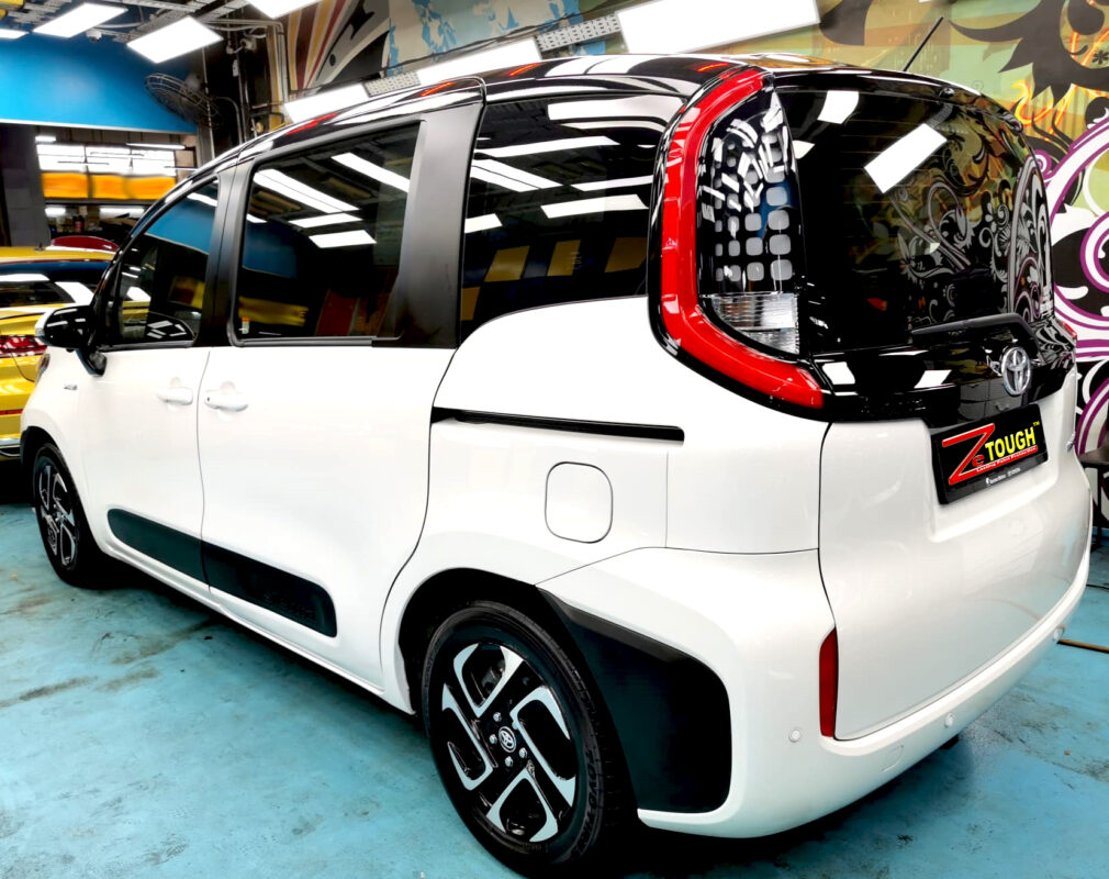 Rear quarter of the Toyota Sienta, glossy and protected.