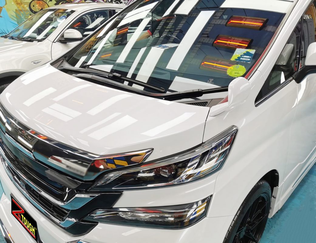 The Toyota Vellfire from a side angle after the ceramic coating.