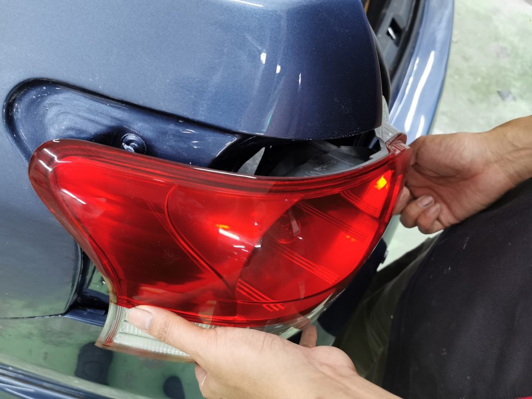Polishing the new paint on the Vios to bring up the shine.