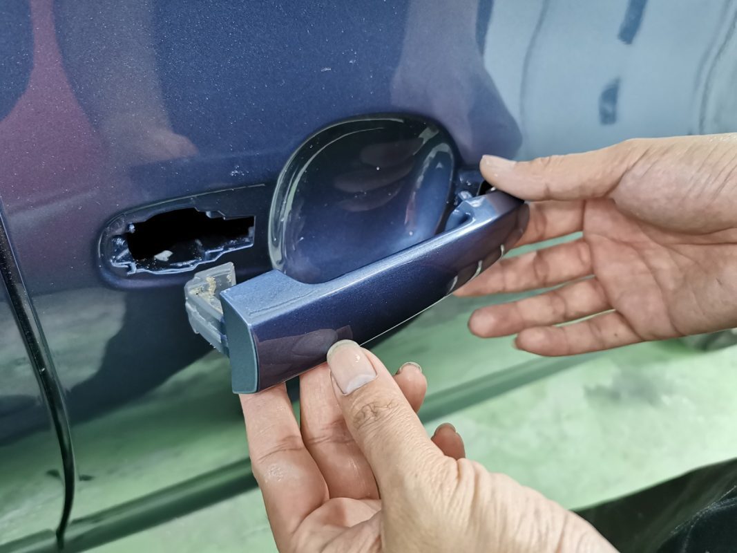 Previously removed car parts being refitted onto the Vios.