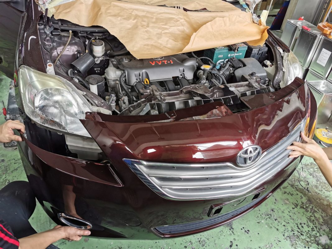 Polishing the new paint on the Vios to bring up the shine.