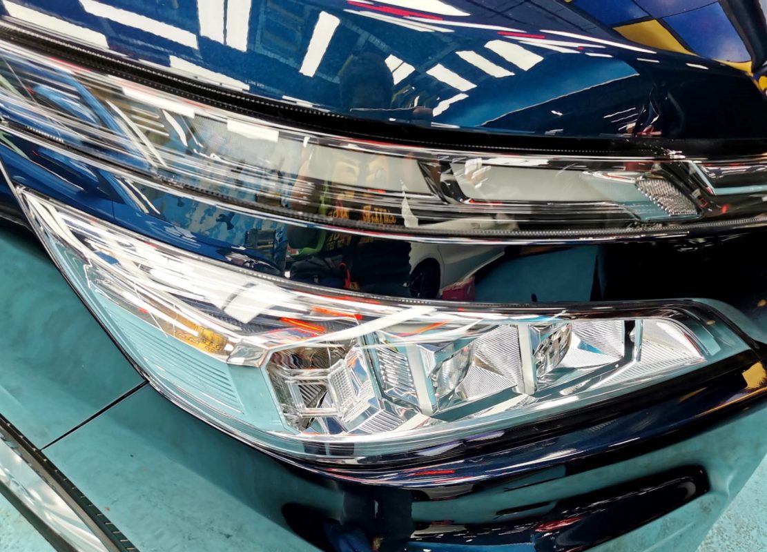 The Voxy's coated paintwork showing clean reflections.