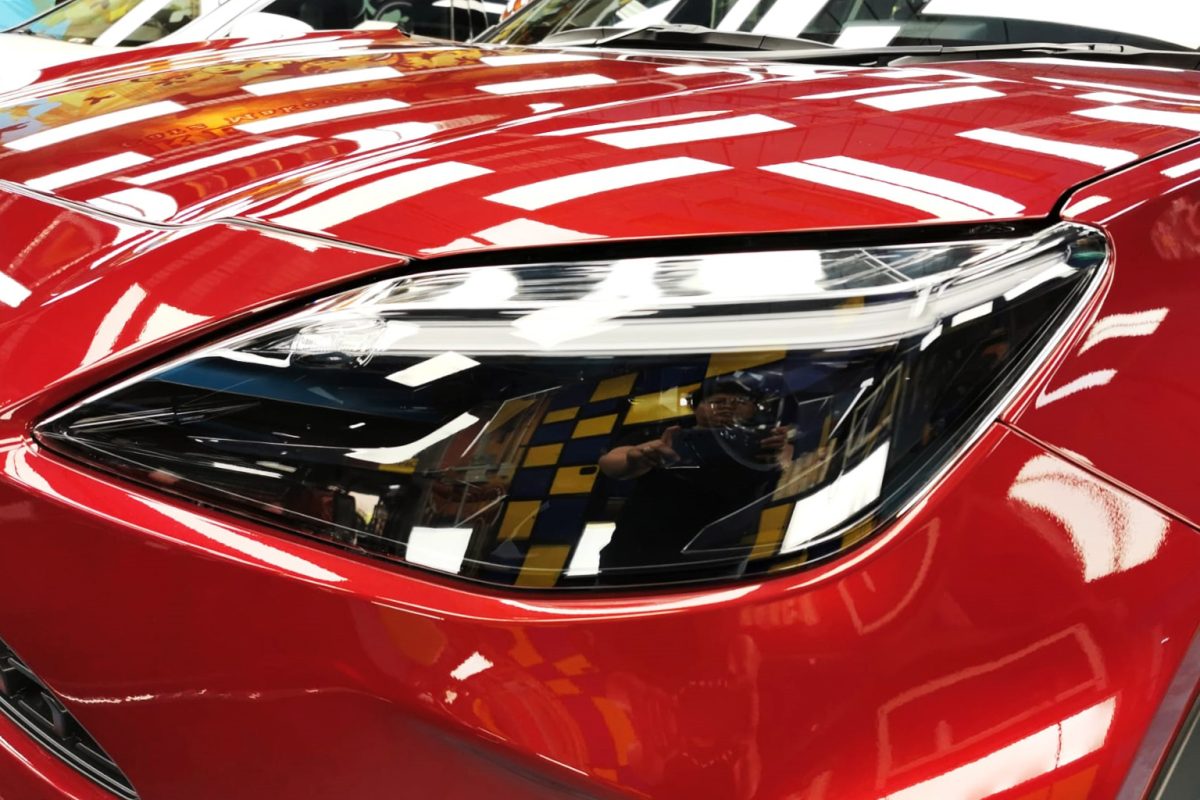 The Yaris's coated paintwork showing clean reflections.