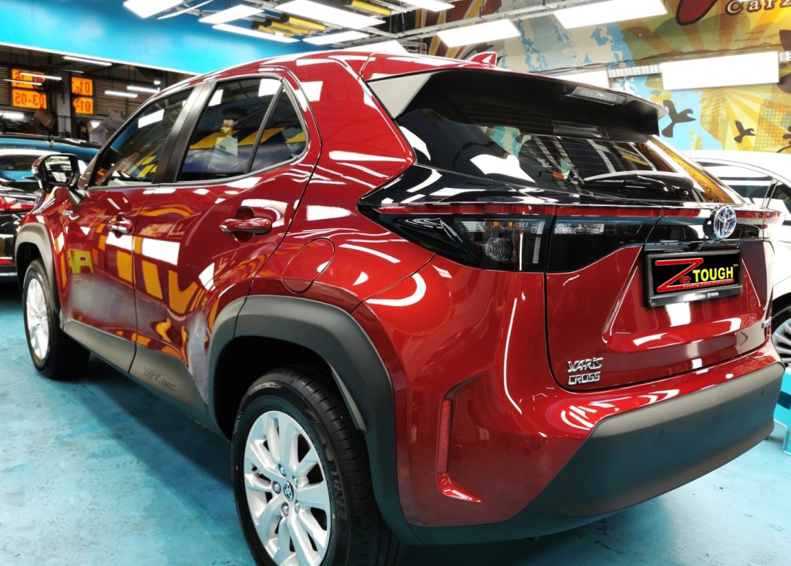 Rear quarter of the Toyota Yaris, glossy and protected.