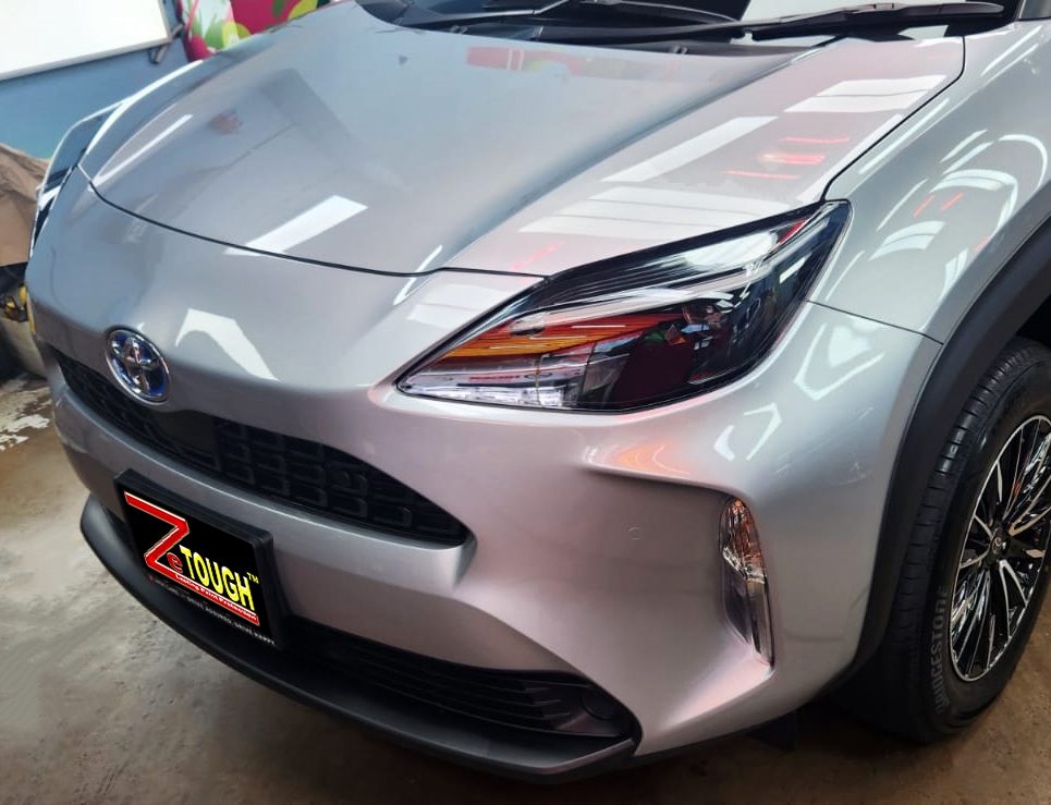 The Toyota Yaris from a side angle after the ceramic coating.