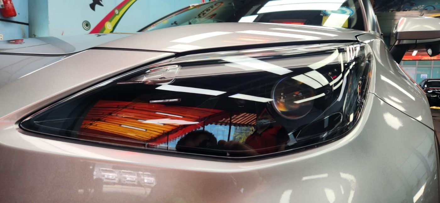 The Yaris's coated paintwork showing clean reflections.
