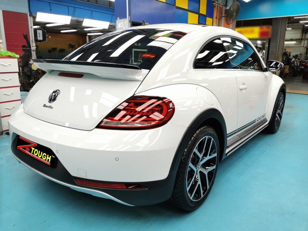 Rear quarter of the Volkswagen Beetle Dune, glossy and protected.
