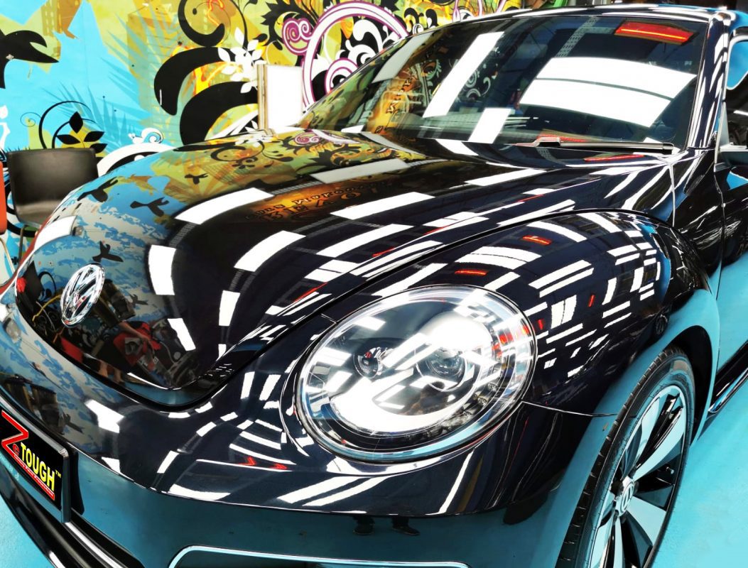 The Volkswagen Beetle from a side angle after the ceramic coating.