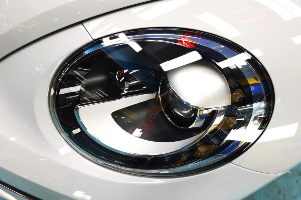 The Beetle's coated paintwork showing clean reflections.