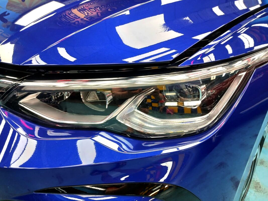 The Golf's coated paintwork showing clean reflections.