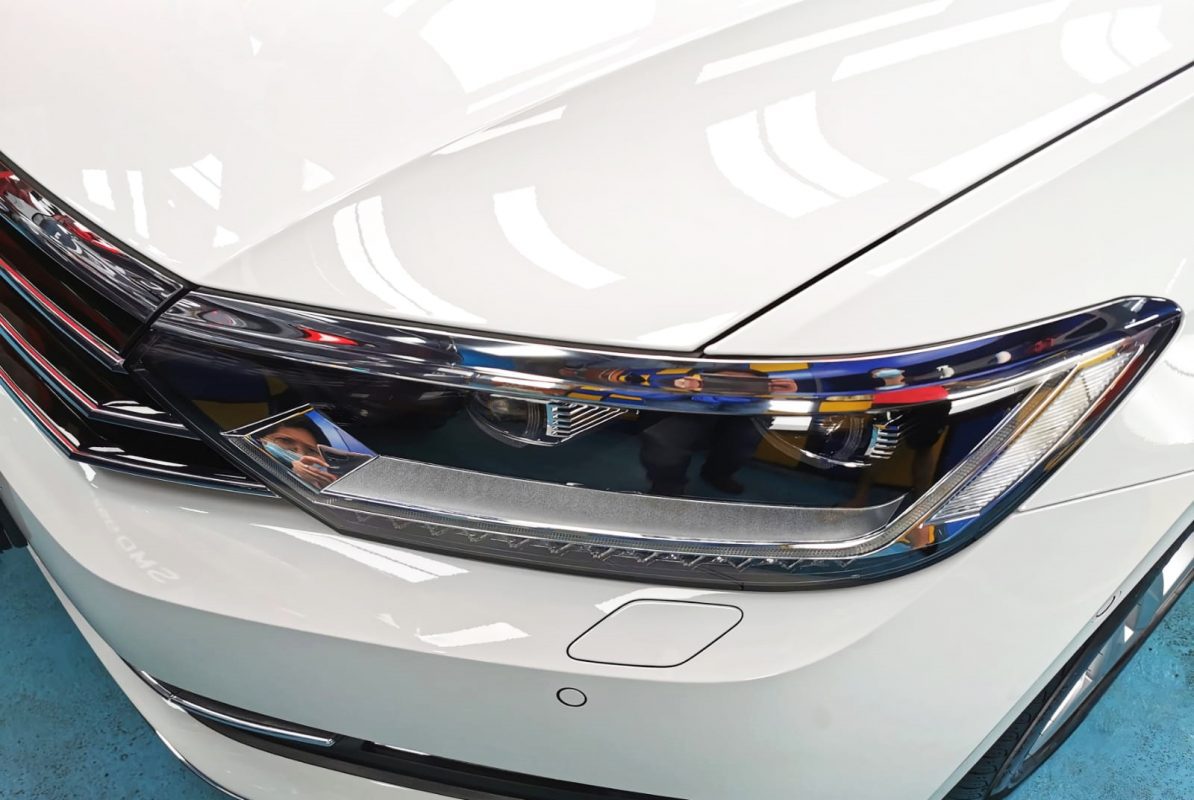 The Passat's coated paintwork showing clean reflections.