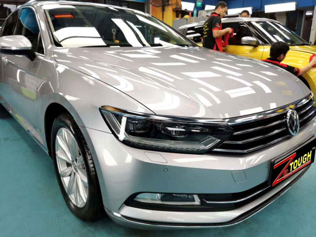 The Volkswagen Passat from a side angle after the ceramic coating.