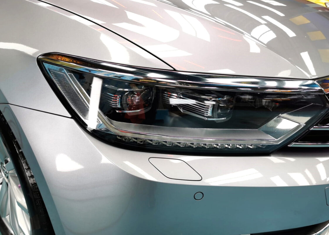 The Passat's coated paintwork showing clean reflections.