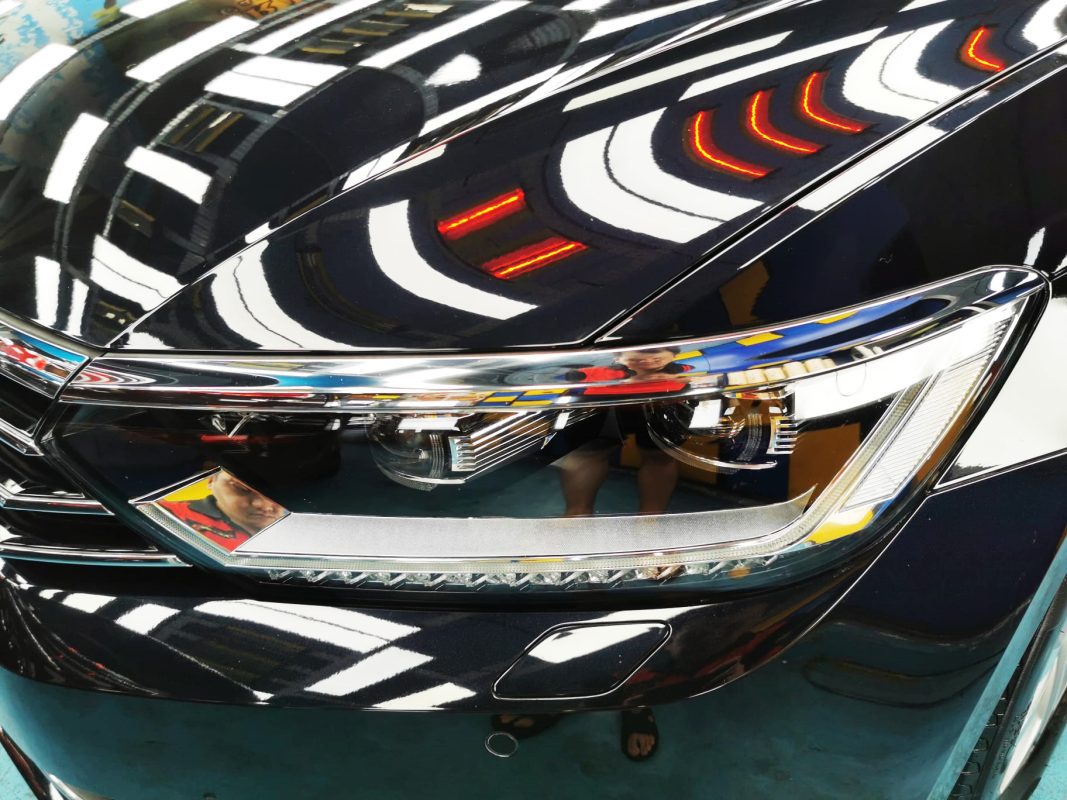 The Passat's coated paintwork showing clean reflections.