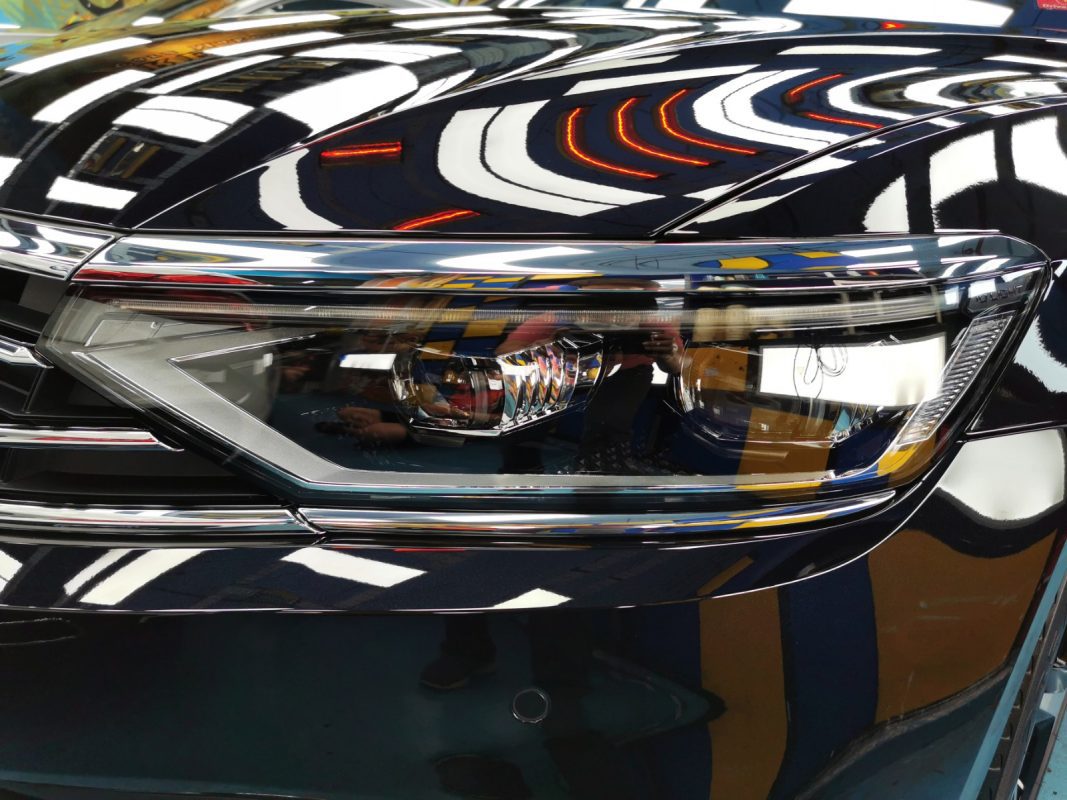 The Passat's coated paintwork showing clean reflections.