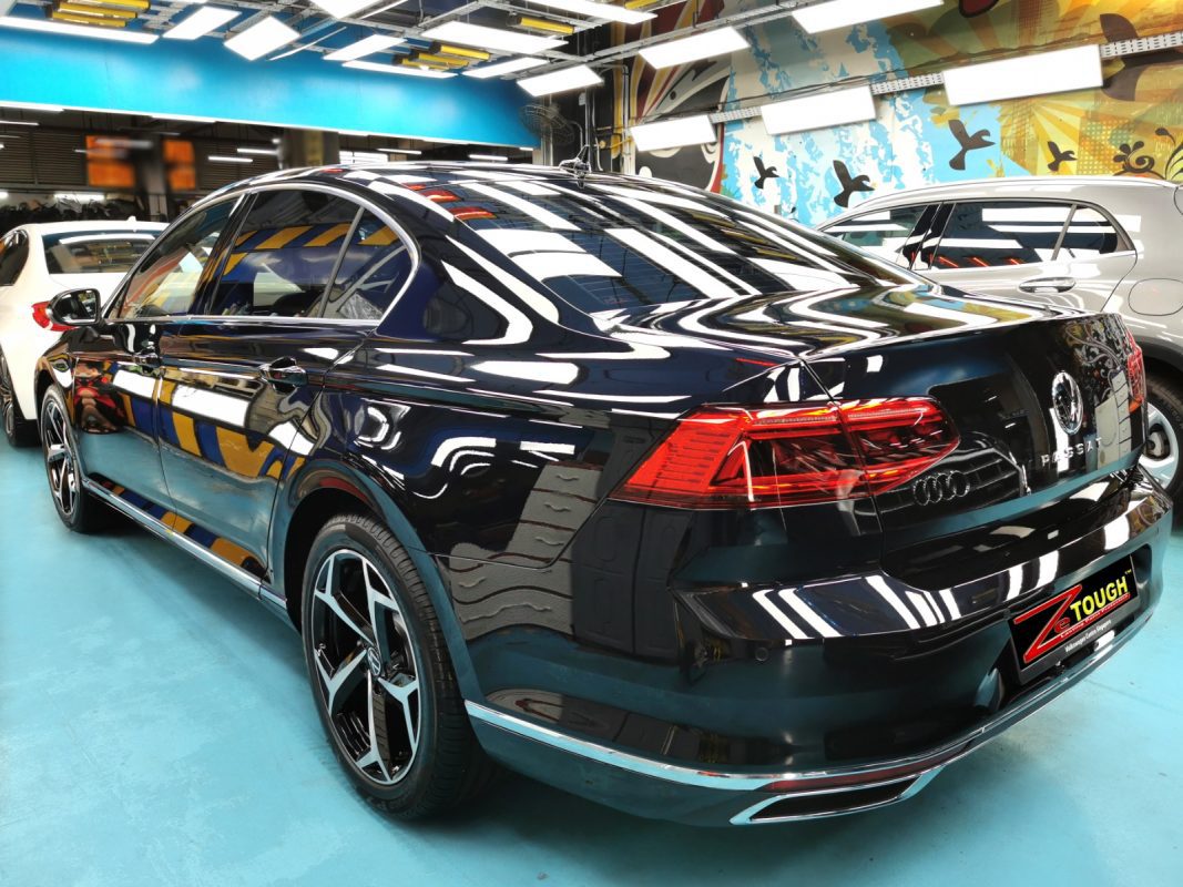 Rear quarter of the Passat, glossy and protected.