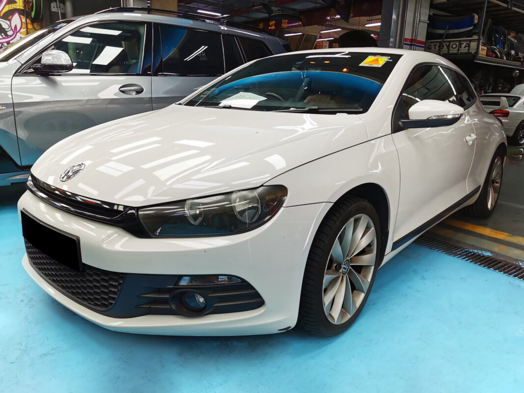 The Volkswagen Scirocco at arrival, front view showing worn and damaged paintwork.
