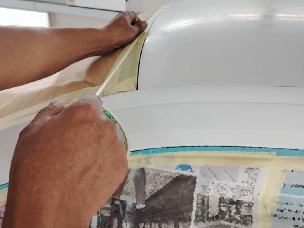Fresh coat laid across the Scirocco's panels inside the booth.