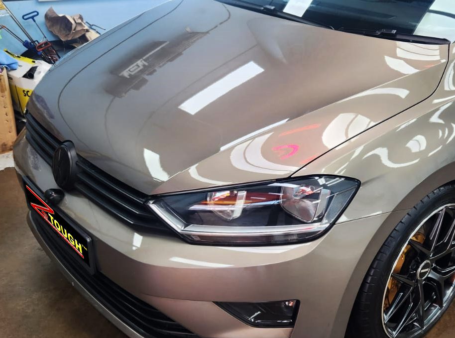 The Volkswagen Sportsvan from a side angle after the titanium coating.