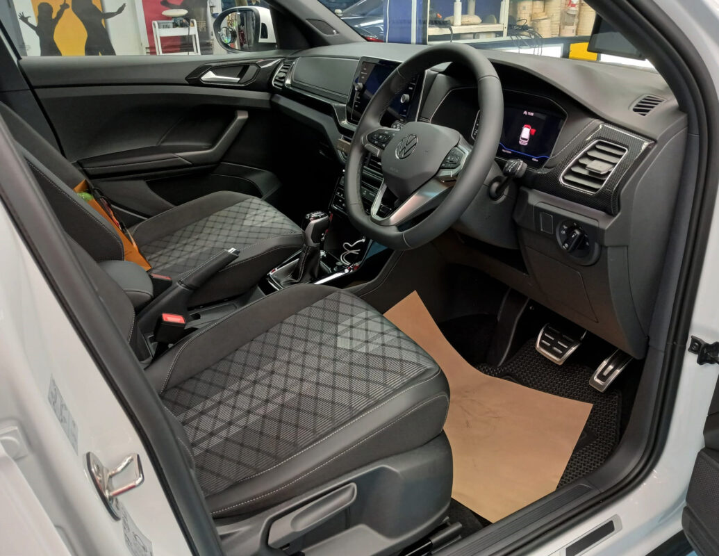 The Volkswagen T-Cross parked in the workshop, freshly coated.