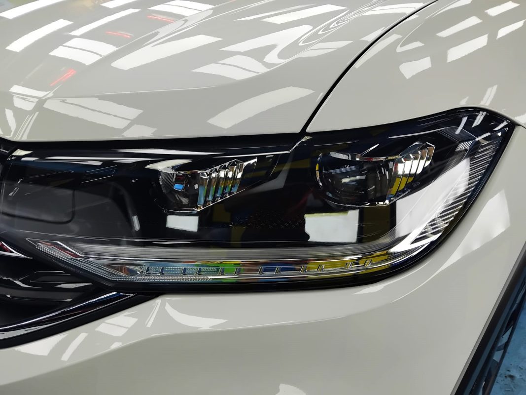 The T-Cross's coated paintwork showing clean reflections.