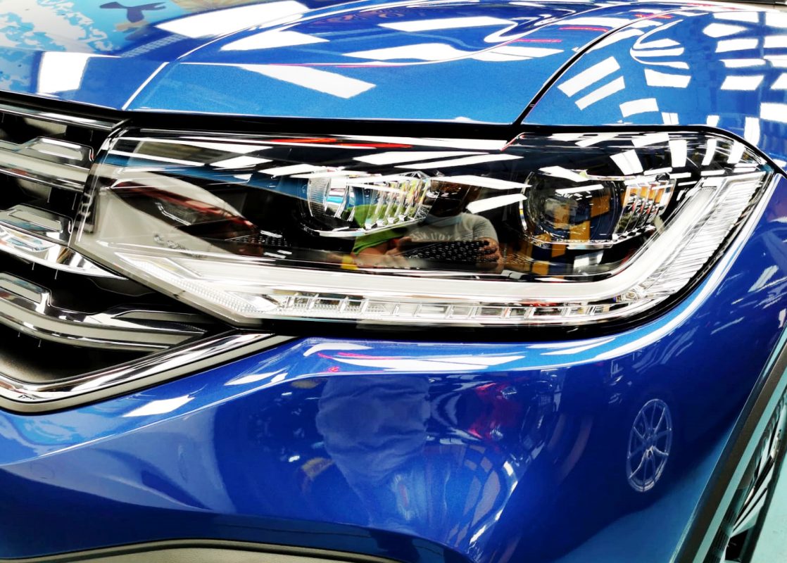 The T-Cross R-Line's coated paintwork showing clean reflections.