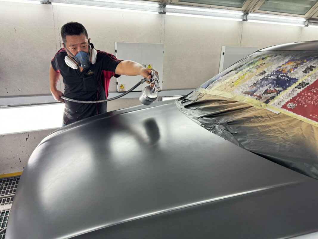 The new coat being applied to the Volkswagen Tiguan inside the spray booth.