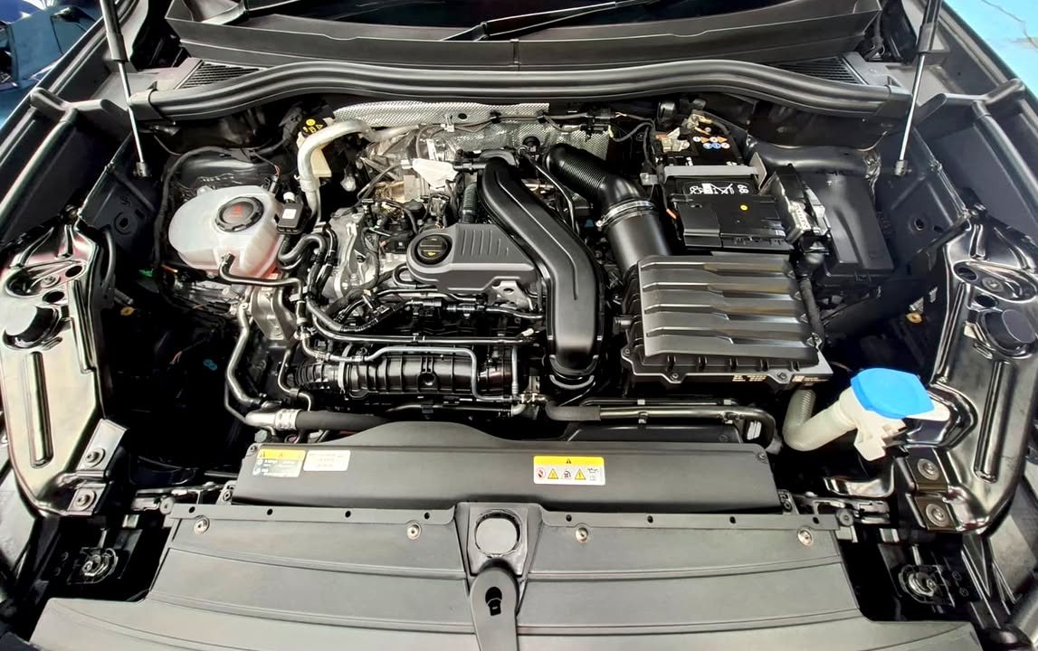 Engine bay of the Volkswagen Tiguan after cleaning.
