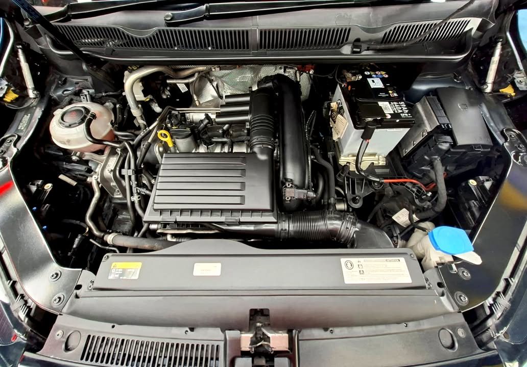 Engine bay of the Touran with the bonnet open.