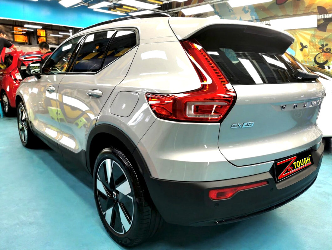 Rear quarter of the Volvo EX40, glossy and protected.