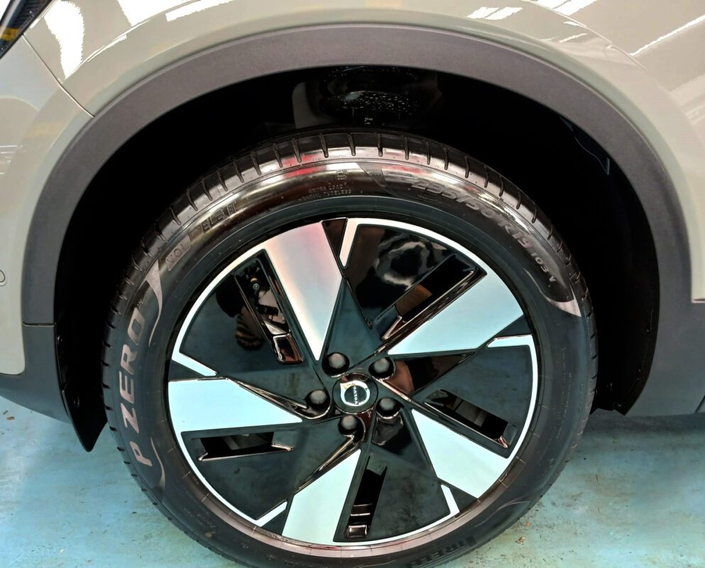 Rear quarter of the Volvo EX40, glossy and protected.