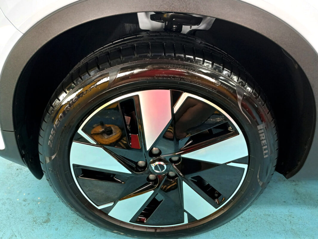 Rear quarter of the Volvo EX40Plus, glossy and protected.