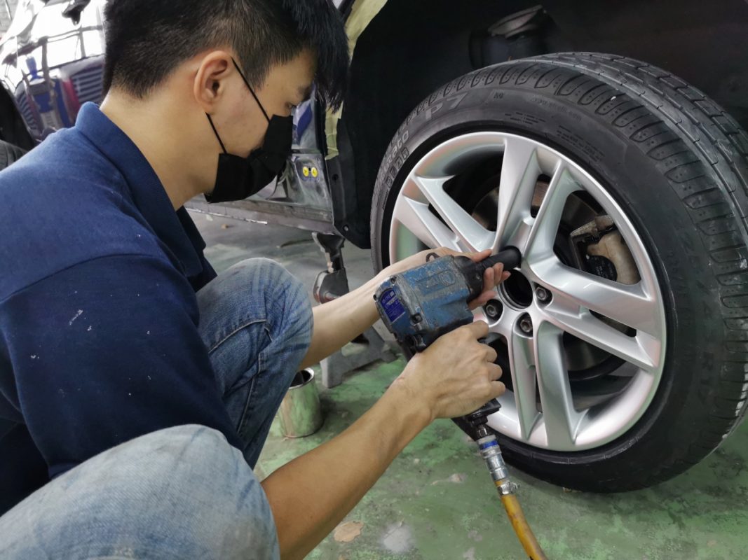 Previously removed car parts being refitted onto the S60.