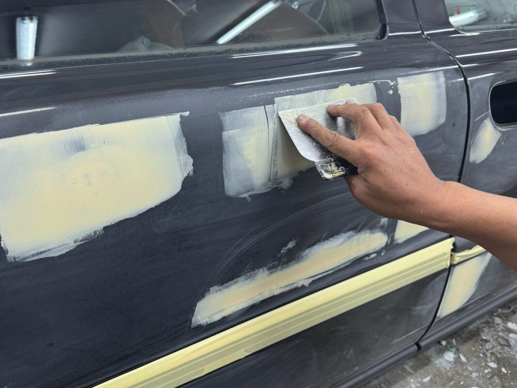 The Volvo S60R at the start of Day 3, panels being inspected for scratches and dents.
