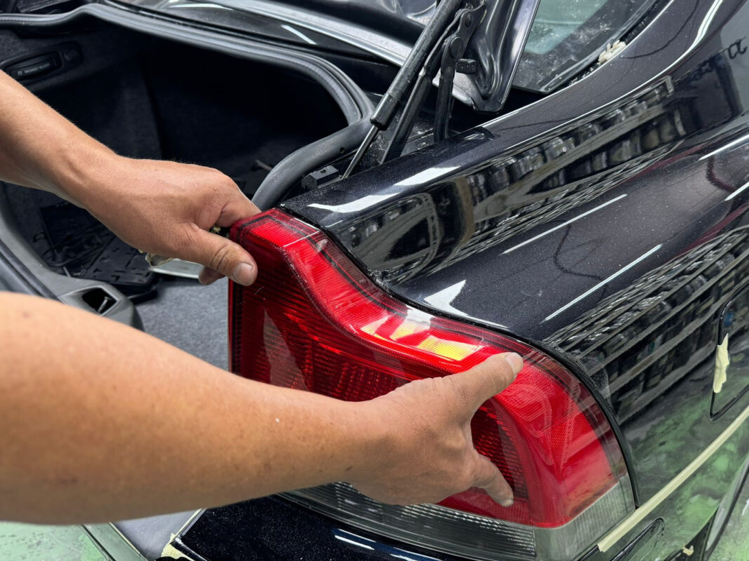 Machine-polishing the Volvo S60R to bring the fresh paint up to a deep gloss.
