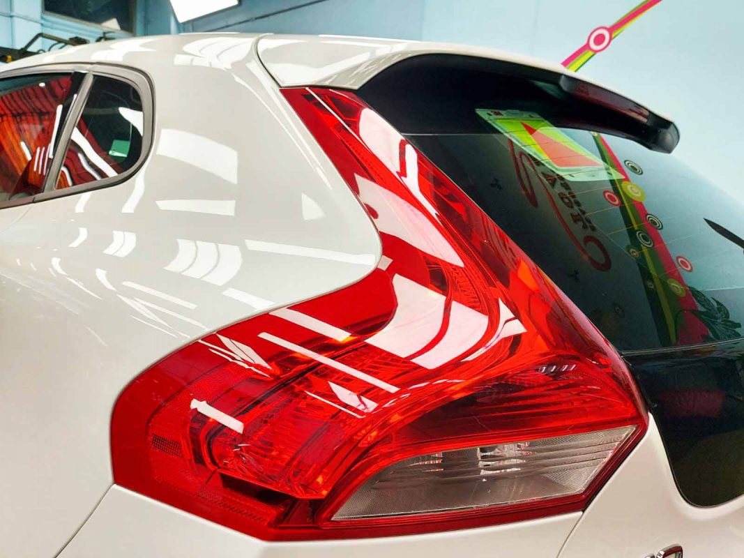 The coated bonnet of the Volvo V40 under workshop lighting.