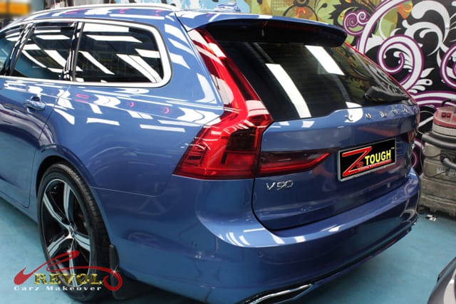 Rear quarter of the Volvo V90 station wagon, glossy and protected.