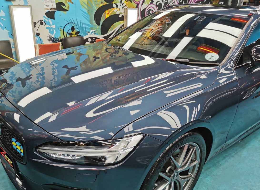The Volvo V90 from a side angle after the ceramic coating.
