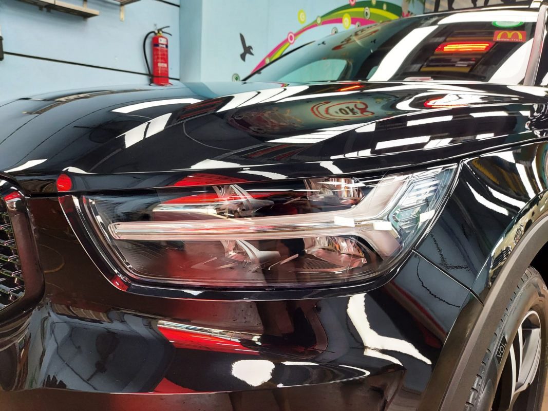 The XC40's coated paintwork showing clean reflections.