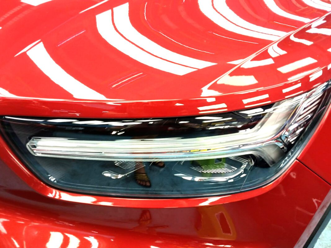 The XC40's coated paintwork showing clean reflections.